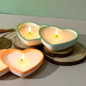 Double heart candle in silicone mold with wood base and cinnamon sticks decor