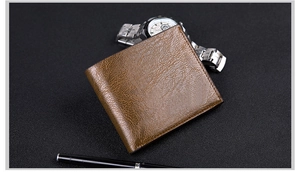 Close-up of brown textured leather bi-fold wallet for men on a dark grey background
