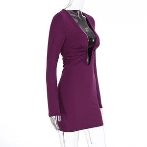 Detail view of deep purple long sleeve mini dress featuring ruched waist and deep U-neckline