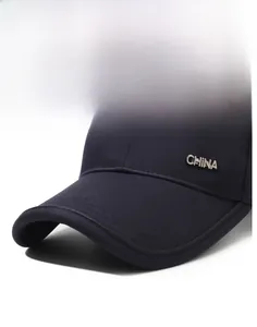 Close-up of a navy blue baseball cap with silver metal CHINA logo and reinforced brim