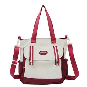 Large ivory canvas tote bag with burgundy straps and multi-pockets for casual daily use