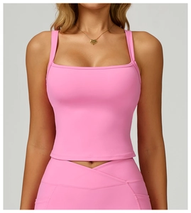 Detail of hot pink yoga tank with square neck and V-cross high waist leggings set