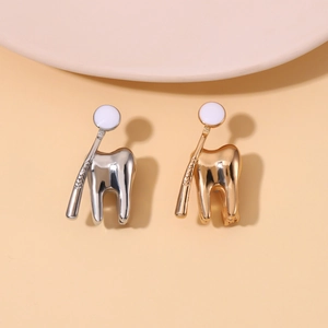 Cartoon tooth enamel pin set in gold and silver finish, fun dental accessory for clothing