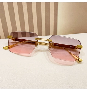 Macro detail of rimless square sunglasses with gradient lens and wood grain temples