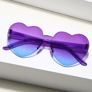 Frameless heart shaped sunglasses with purple blue gradient lenses on white pedestal