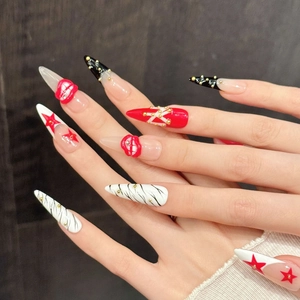 Artistic red and zebra print press-on nails with 3D lip relief and gold stud accents