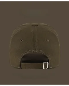 Detail view of cotton baseball cap back with adjustable silver buckle and breathable eyelets