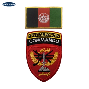 Close-up of embroidered Afghanistan flag and Special Forces Commando tactical patch