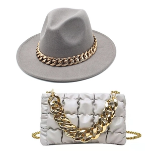 Gray wool fedora hat with gold chain detail and white quilted crossbody bag set