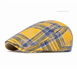 Detail shot of the yellow and blue plaid pattern fabric on a textured flat cap