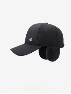 Close-up of black men's winter cap with ear flaps and textured fabric detail