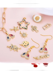 Macro detail of gold-plated copper charms with colorful cubic zirconia for DIY jewelry