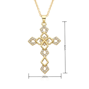 Detailed view of gold cross pendant with cubic zirconia, dimensions 36mm by 24mm