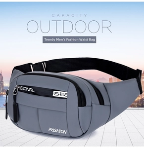 Detailed view of the water-resistant grey waist bag with multiple zipper compartments