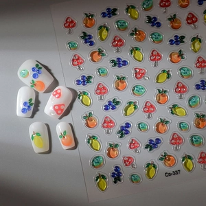 Detailed 5D embossed nail stickers featuring lemons, oranges, and mushroom patterns