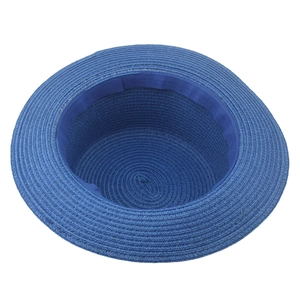 Detail view of the inner grosgrain sweatband and woven straw texture of this blue sun hat