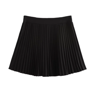 Detailed flat lay of high-waisted black pleated mini skirt with lightweight fabric texture