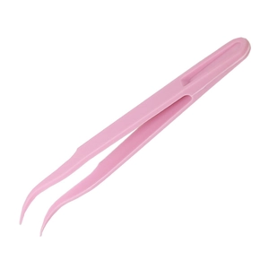 Detailed view of pink curved plastic tweezers for diamond painting and DIY craft work