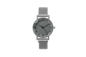 Detail of silver mesh band watch with artistic numbers and grey dial on white background
