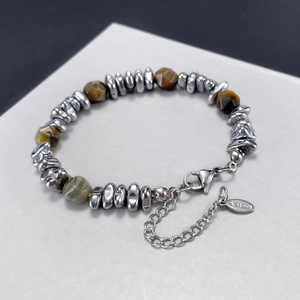 Polished stainless steel bracelet featuring natural tiger eye stones and metallic beads