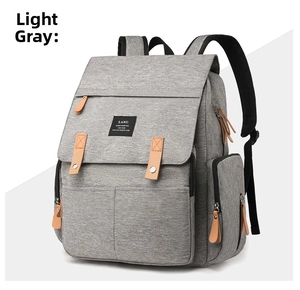 Detail view of light grey large capacity mommy backpack with premium leather zipper pulls