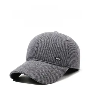Detail of dark grey striped winter cap with ear protection and sport label