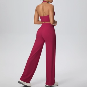 Back view detail of deep red halter yoga top and high-waisted wide leg pants set