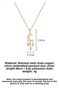 Detail of dreamcatcher pendant with crescent moon and feathers in gold titanium steel