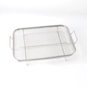 Close-up of a stainless steel rectangular grill pan with handles and perforated oil filter