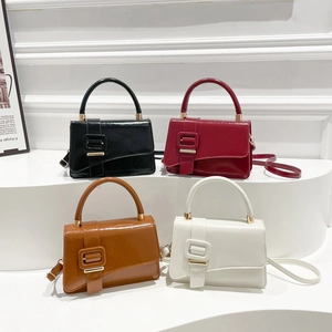 Minimalist square handbags in black, red, brown, and white with decorative belt buckles