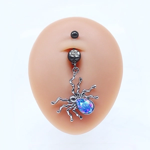 Macro shot of silver spider navel ring with purple pear-cut stone on silicone model