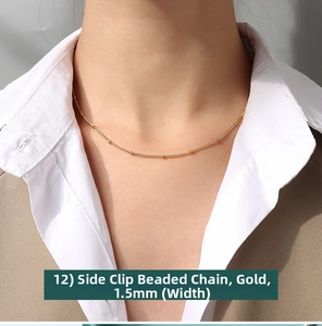 Close-up of 1.5mm gold beaded link chain necklace on model with white shirt