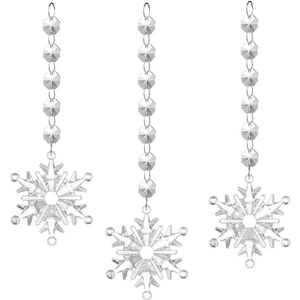 Set of three transparent acrylic snowflake pendants with beaded strings for festive decor