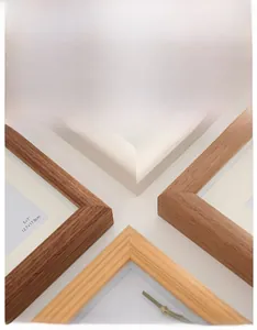 Close-up of Nordic style solid wood picture frame corners in various natural wood finishes
