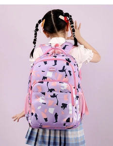 Detail of purple geometric backpack featuring padded straps and durable oxford fabric