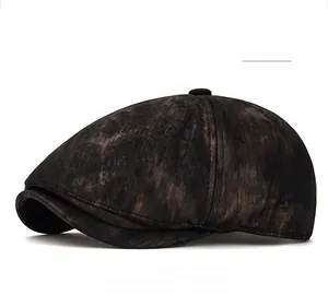 Detail of vintage black newsboy cap with washed texture and reinforced short brim