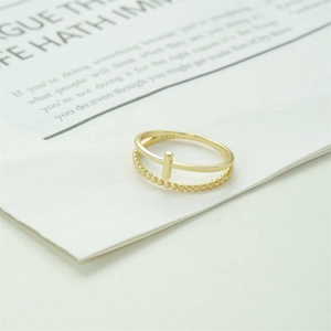 Macro detail of a double-layered S925 silver ring featuring gold plating and S925 hallmark