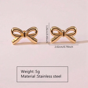 Detailed view of golden stainless steel bow earrings with measurements and 5g weight specs