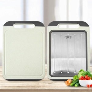 Dual-sided cutting board showing metal defrosting side and non-slip plastic surface