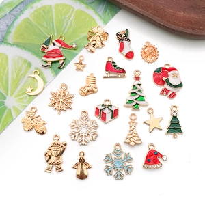 Collection of festive Christmas alloy charms including Santa and snowflakes on white background