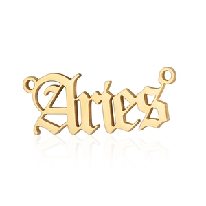 Close-up of golden stainless steel Aries zodiac pendant with gothic letter engraving
