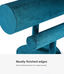 Macro detail of teal velvet headband display stand with handmade flat piping finish