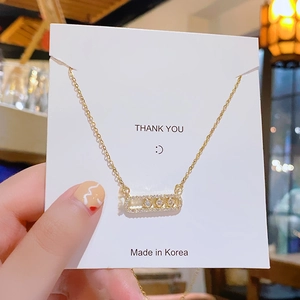 Minimalist gold plated titanium necklace with rectangular zircon pavé sliding pendant