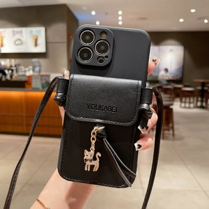 Black iPhone case with leather card pouch, cat pendant and long crossbody strap