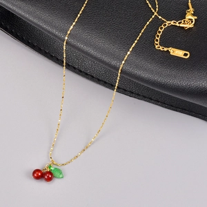 18K gold plated stainless steel necklace with red carnelian cherry pendant on leather