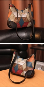 Detail showing retro leather patchwork underarm bag with geometric color blocks