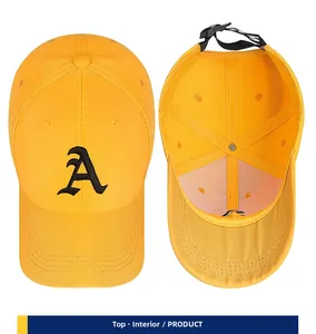 Detail view of yellow cotton baseball cap with gothic A embroidery and adjustable back strap