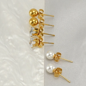 Three-pair earring set featuring gold beads, white pearls and clear cubic zirconia studs