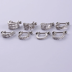Macro shot of 8 silver stainless steel cartilage earrings with cubic zirconia inlays
