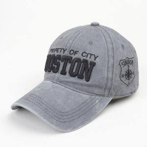 Macro view of washed grey baseball cap with Property of City Boston 3D embroidery